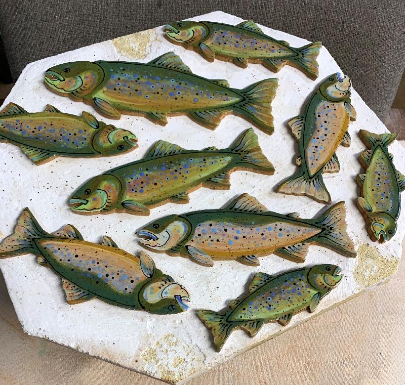 Trout tiles hot out of the kiln